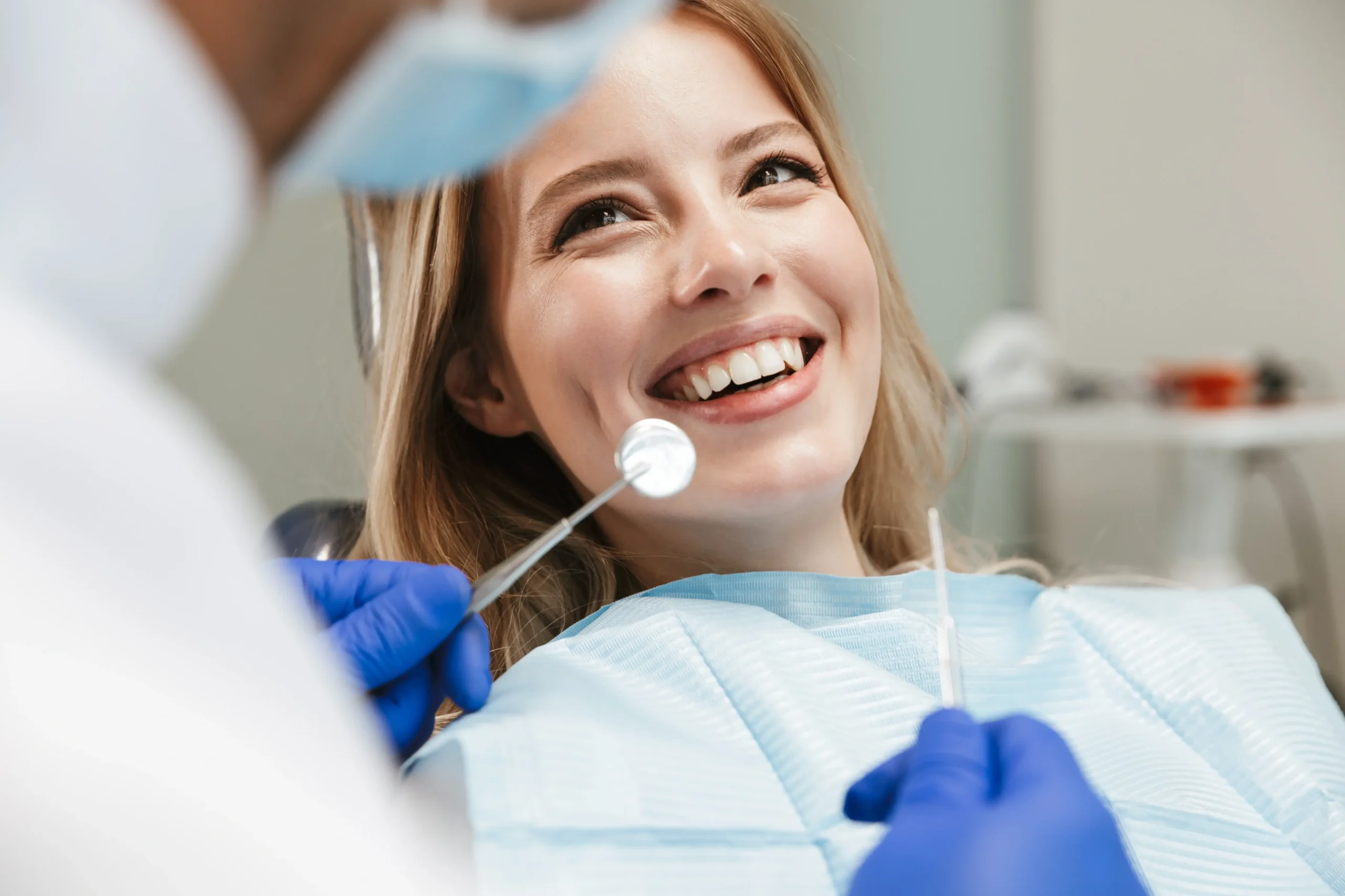 Dental Young woman smiling in a dental chair